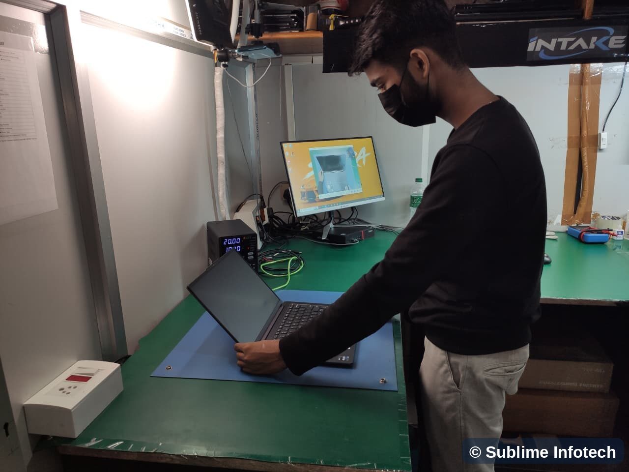 Intake desk with overhead camera recording a laptop